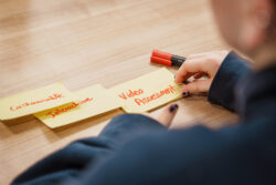Student holding post-it notes.